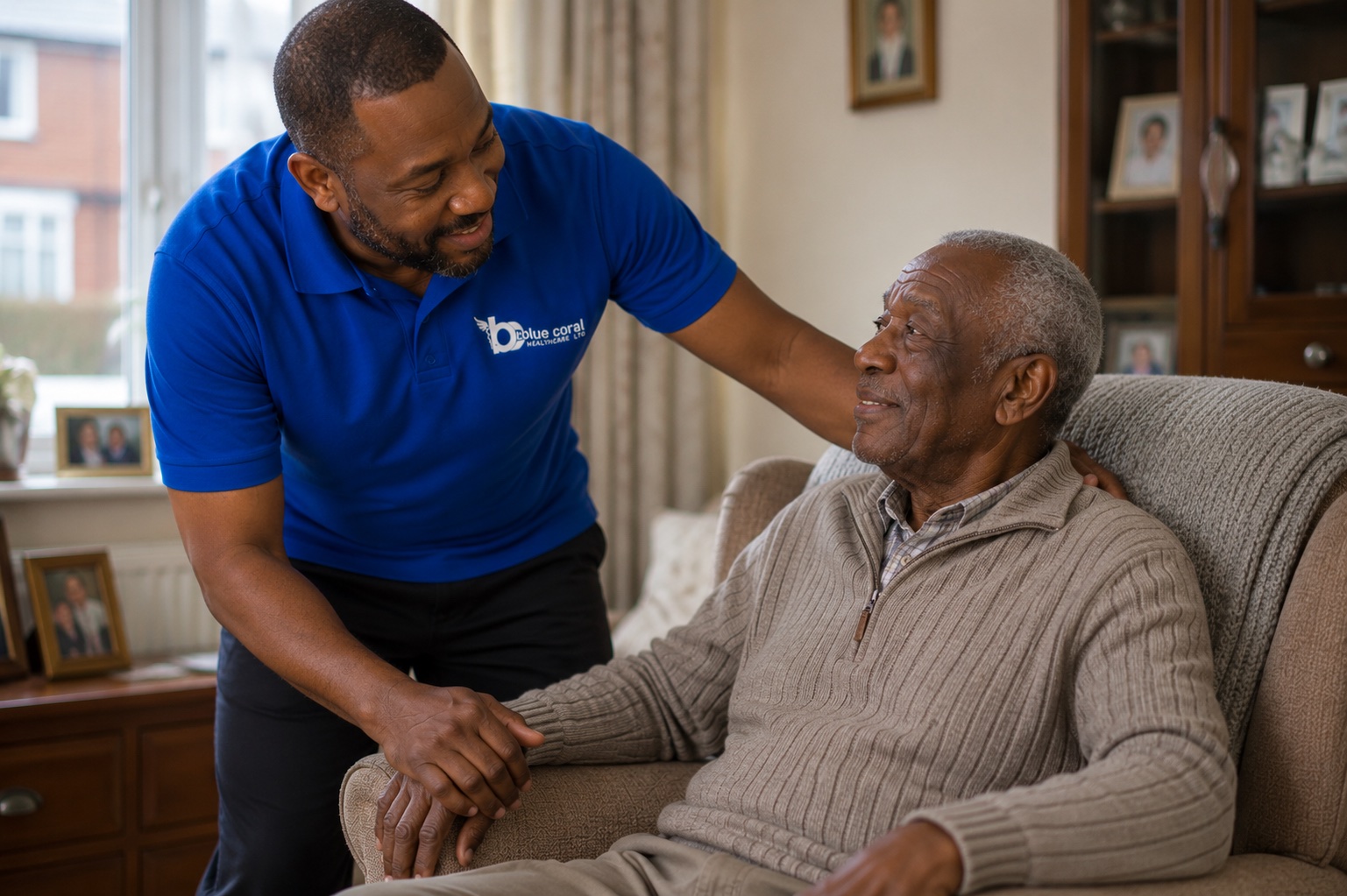 Blue Coral Healthcare live-in carer helping an elderly man settle comfortably at home across the UK