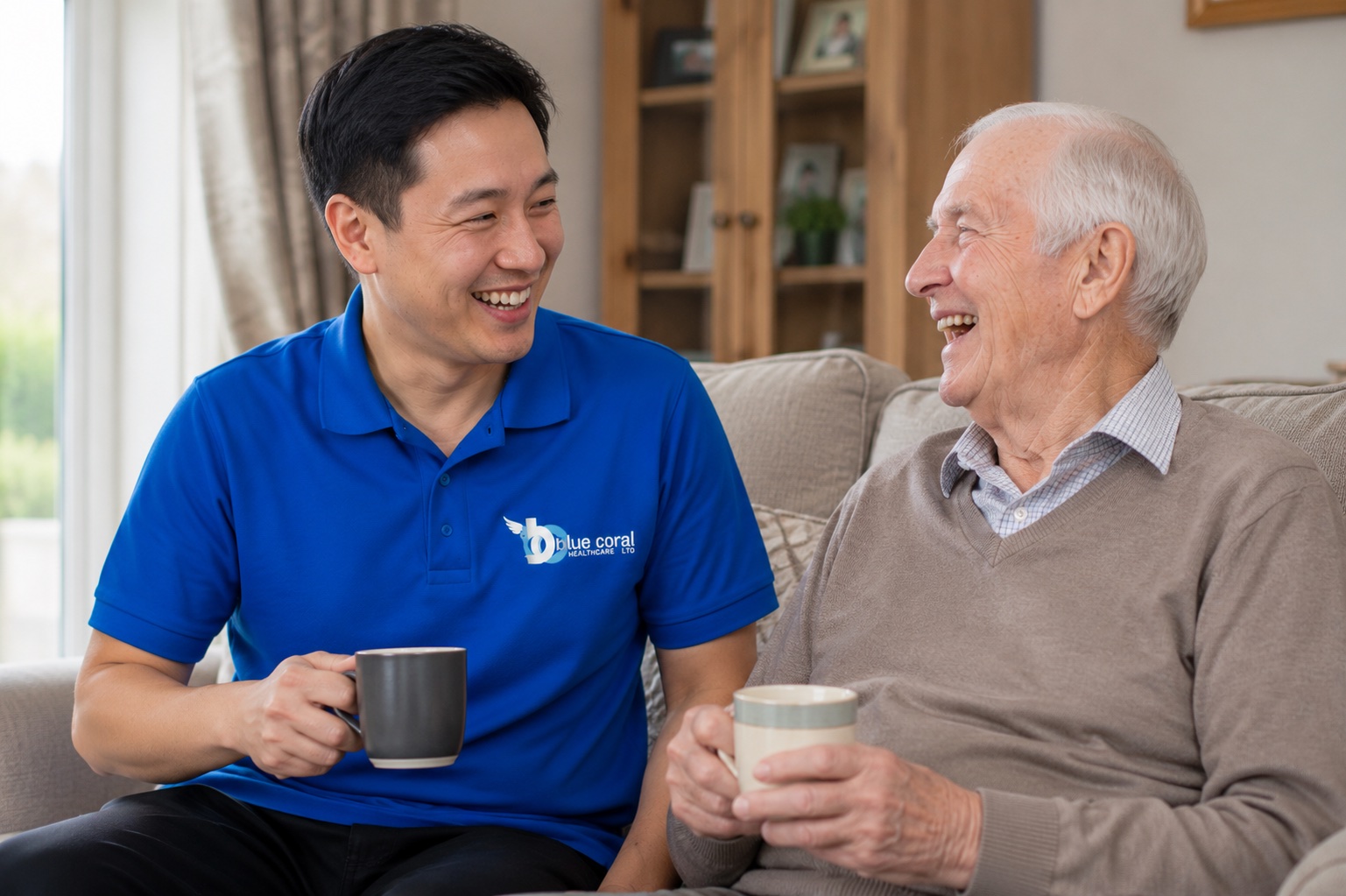 Blue Coral Healthcare carer enjoying companionship with an elderly man at home