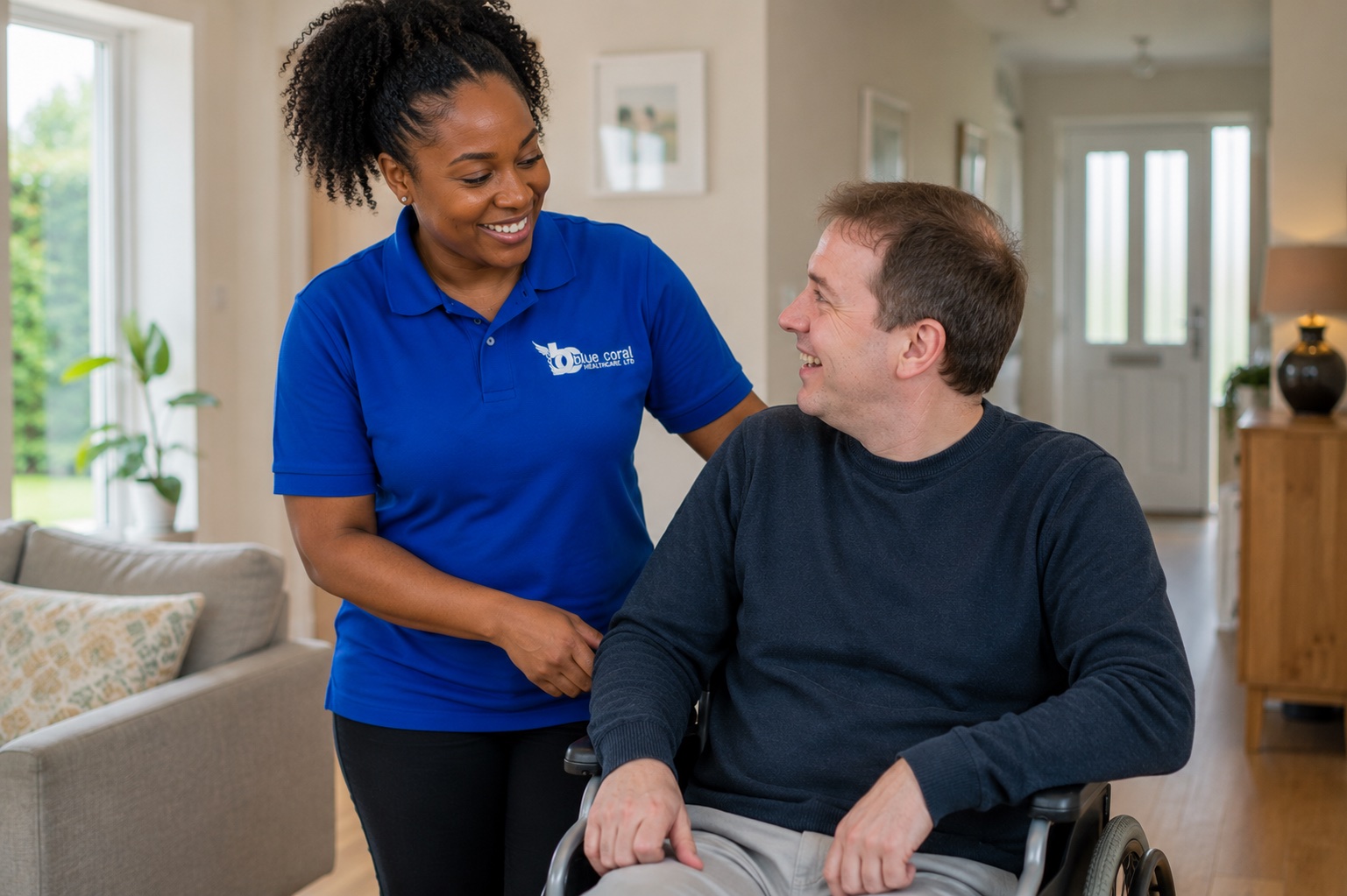 Blue Coral Healthcare carer supporting a wheelchair user with daily living at home across the UK