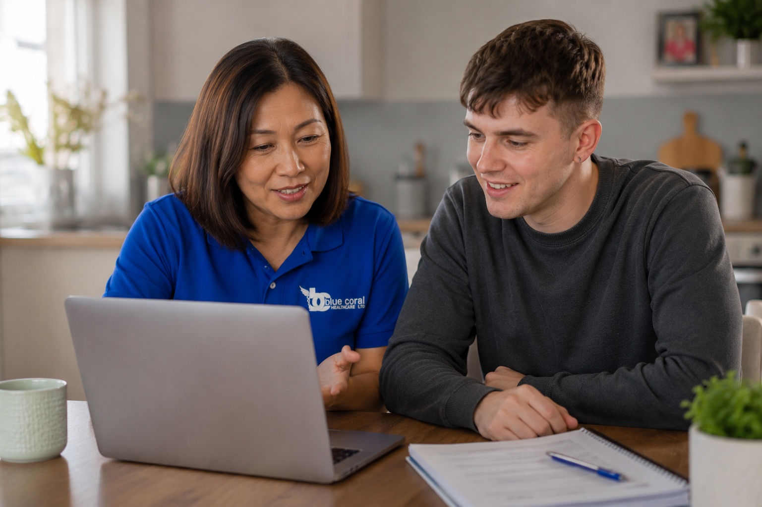 Blue Coral Healthcare support worker helping a young adult explore education and work options