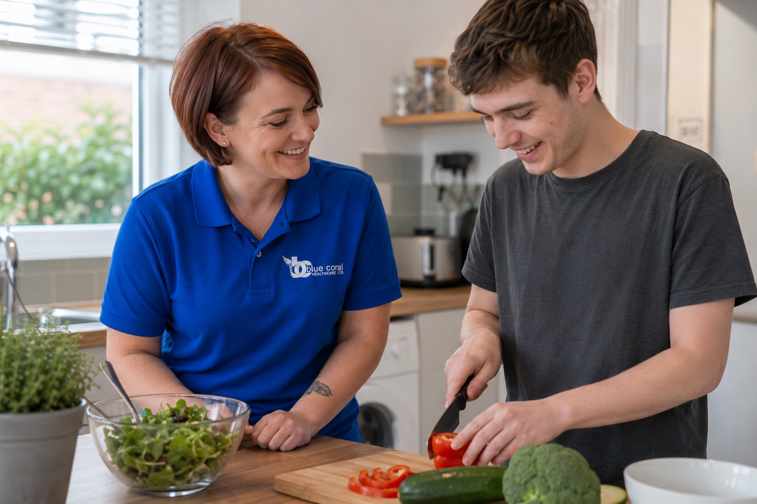 Blue Coral Healthcare support worker helping a young adult build independence skills at home across the UK